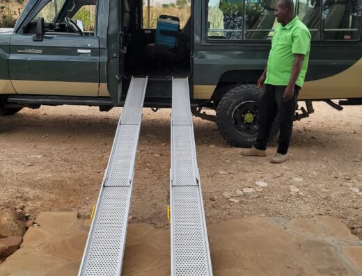 Land Cruiser with ramps down and driver-guide ready