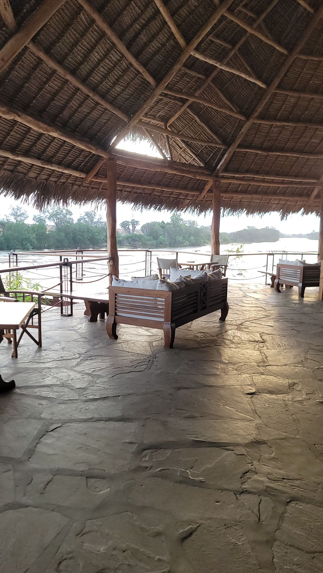 Open-sided riverside dining area at Kiboko River Camp